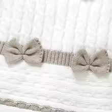 Barboteuse fille détail tricot petits noeuds 